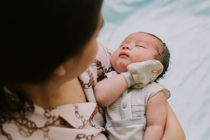 Woman holding a baby